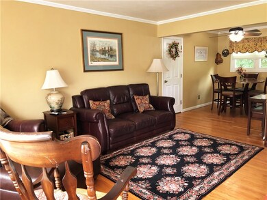 The entryway leads to the living room which is ope