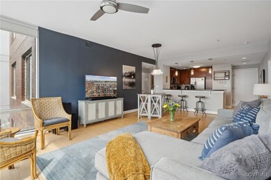 Living room with baseboards, visible vents, light
