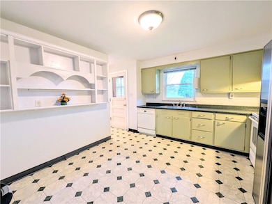 Spacious kitchen with window view to back yard.