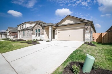 Ranch-style house featuring driveway, a garage, b