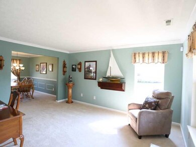 Living Room. The large formal living room features a tasteful color palette and is spacious enough for larger furnishings.