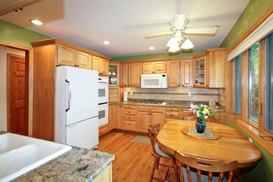 Updated kitchen with hickory cabinets and quartz c