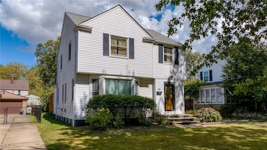 View of front facade with a shingled roof