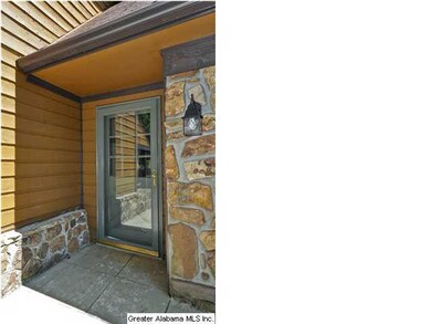 Original stone and freshly painted cedar siding fo