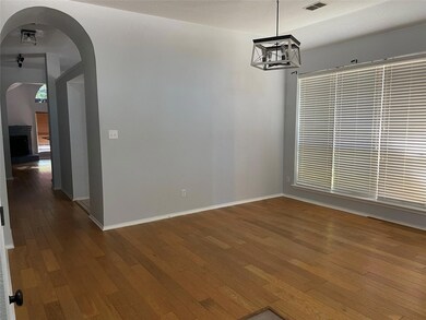 Spare room with dark hardwood / wood-style floors