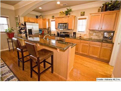 Kitchen has stainless appliances, granite counter 