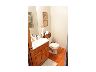 Hardwoods in half bath off of kitchen/dining room