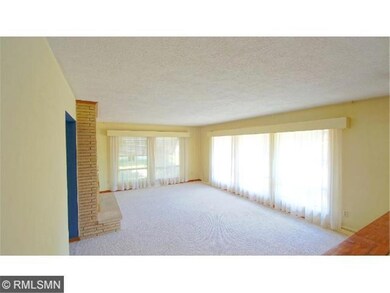 Living Room on main level features a brick, wood b