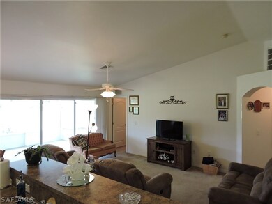 Family room view with triple sliders to rear lanai