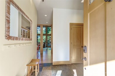 Spacious entry with durable slate floors.