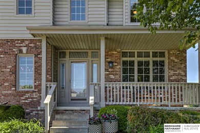 Check out the porch, partial brick front and permanent siding.  No maintenance!!!