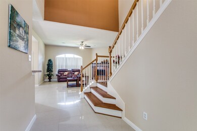 High-ceiling entrance offers plenty of natural light and impeccable flooring!