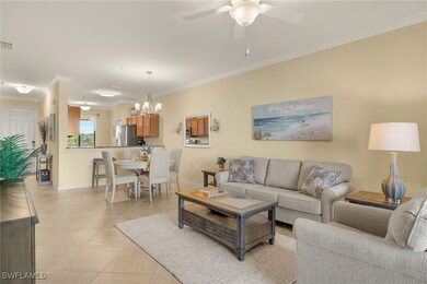 Living room with baseboards, crown molding, light