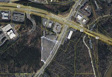 Aerial map of property and surrounding area featuring property boundaries highlighted