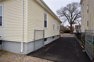 Oversized new asphalt driveway.