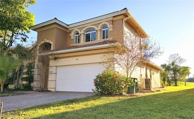 View of front of home featuring a tile roof, stucc
