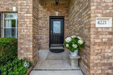 Entrance to property featuring brick siding