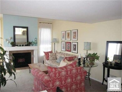 Charming living room with fireplace & vaulted ceil