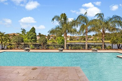 A modern Oasis. Sleek lines meet natural serenity in this striking pool design, featuring cascading waterfalls, towering palms and a tranquil canal that stretches into the landscape - every element crafted for resort-caliber relaxation.