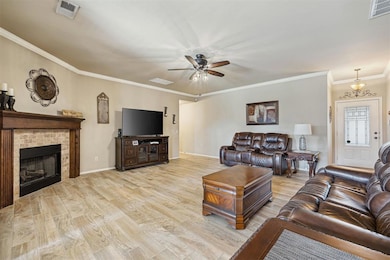 Living area featuring wood finished floors, visibl