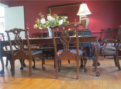 Elegant formal dining room also offers hardwoods!  Enjoy family dinners or entertain in this lovely space!!