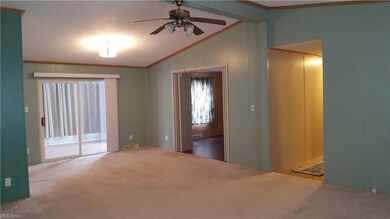 Dining area with slider to sun-room. French doors 