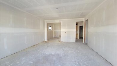 Living area looking at dining and kitchen entry