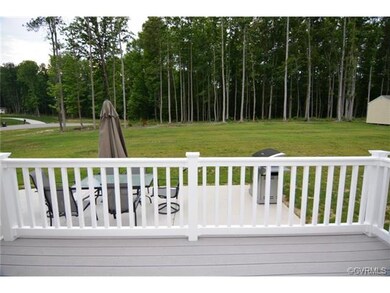 Large private backyard backs to wooded area.