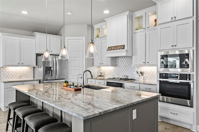 Kitchen with appliances with stainless steel fini