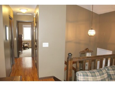 Hallway has original good oak hardwood floors.