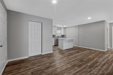 View from family room toward the kitchen, and laun