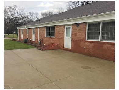 back of home with large patio area and huge yard