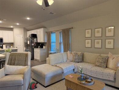 Living room featuring recessed lighting, ceiling fan, and wood finished floors