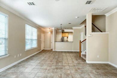 Unfurnished living room featuring crown molding, 