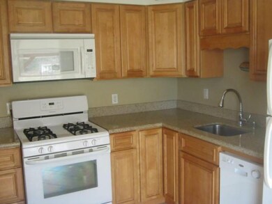 Kitchen MAPLE CABINETS, GRAINTE COUNTERS, CERAMIC 