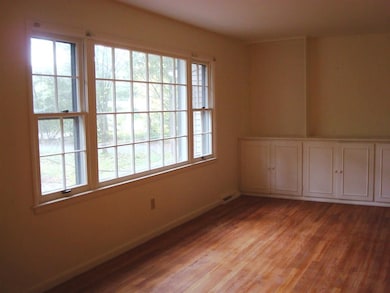 Large picture window and built in cabinets