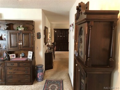 View from front entry,  down the hall to kitchen a