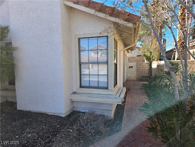 View of exterior entry with stucco siding