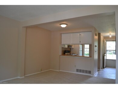 Spacious dinette area opens to sparkling white kit