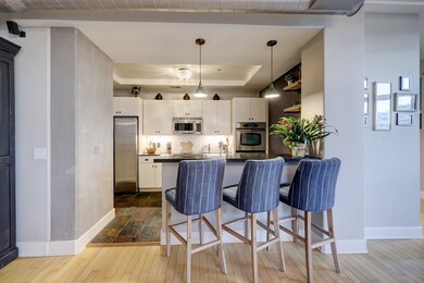 The extensive counter space and breakfast bar that