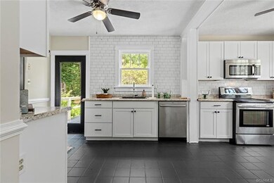 Updated and renovated, new cabinets, tile floor, t