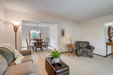 An expansive, sun-drenched formal living room and dining room, perfect for hosting gatherings and creating cherished memories.