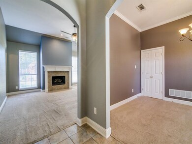 From entry views formal dining (double door leads to kitchen); Living area with fireplace