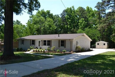 Nice, level driveway that leads to back of home wi
