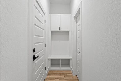 Mudroom featuring light hardwood / wood-style floo