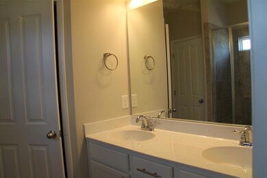Double vanities included in the master bath.  Similar house.