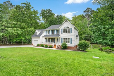 Colonial inspired home with covered porch, gravel