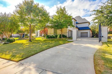 Electric gate and sidewalk entrance to garage. One single bay and One three-bay, both having access to the house.