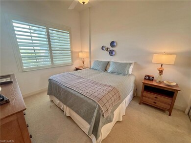 Guest bedroom featuring ceiling fan and connected 