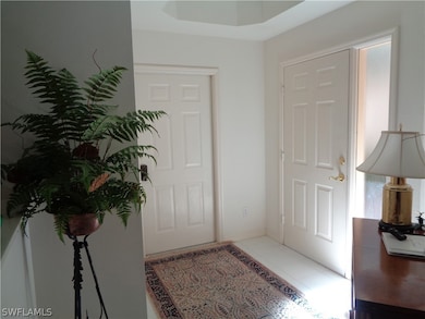 Foyer entrance with tile floors